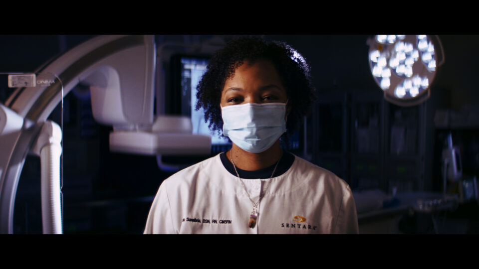 Nurse in front of Medical Scanner